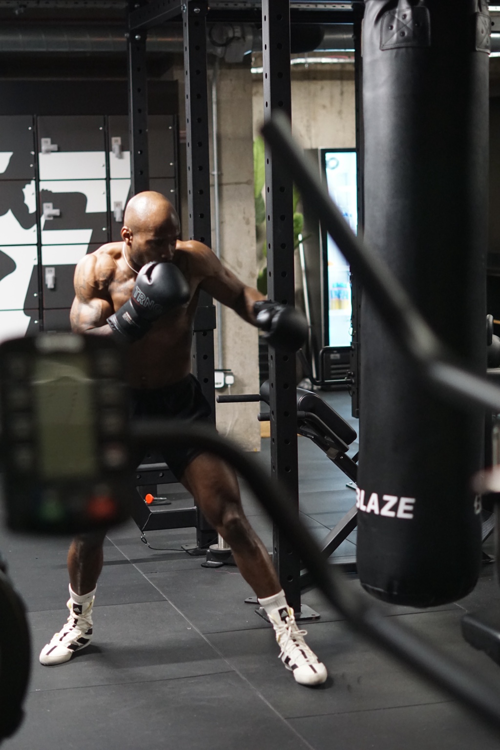 A boxer training on the heavy bag at Training Club Manchester