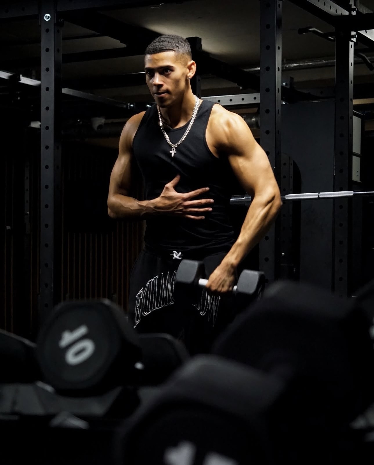 Client training with dumbbells at Training Club