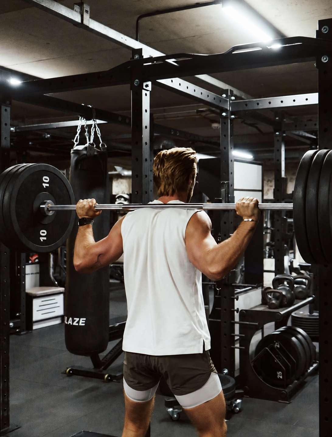 An athlete completing a coached barbell strength session at Training Club Manchester